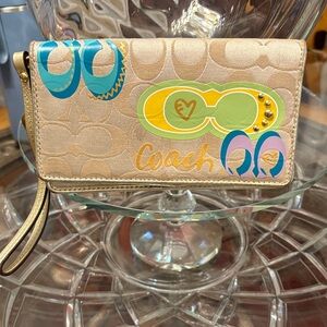 Coach Poppy "Daisy Pop" Graffiti wristlet wallet.